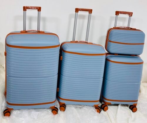 4 valises de voyage en polypropylène Solides, légères et au design moderne.Neuf jamais utilisé